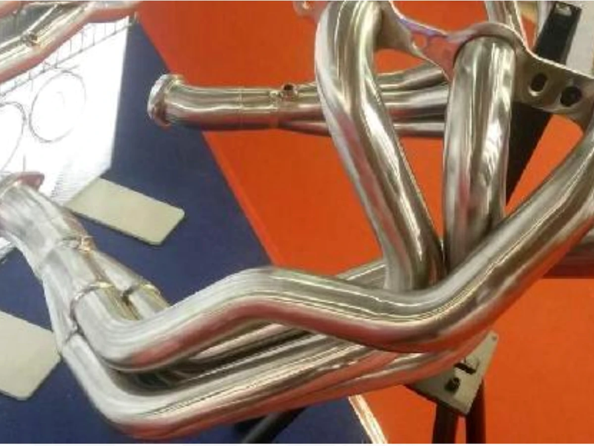 Stainless steel shaped exhaust manifold tubes from the JAYU hydroforming product catalog