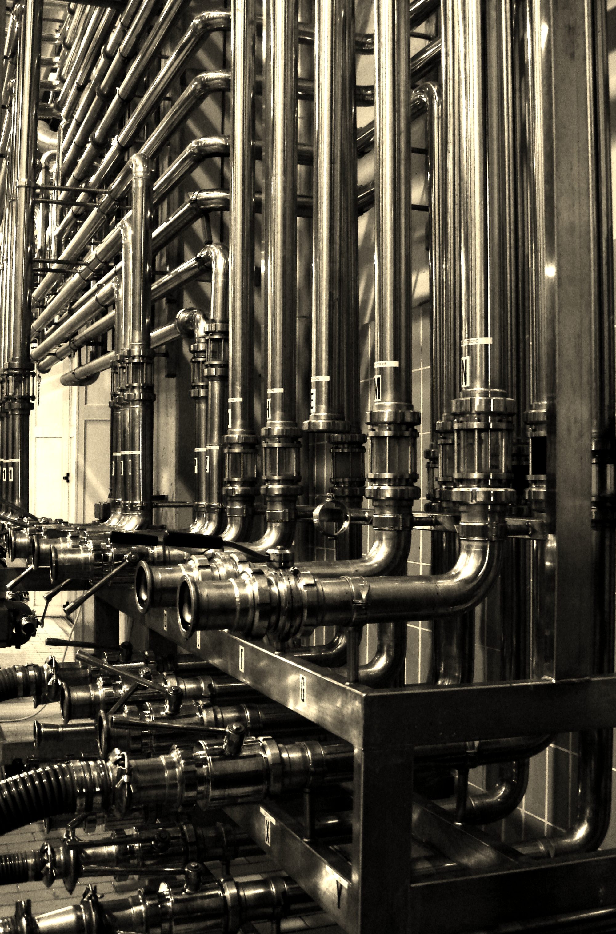 Stainless steel tube manifold, bends, valves, and fittings in a food and industrial fluid system