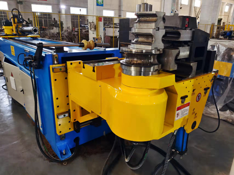 Stainless steel tube bending equipment in a Chinese factory workshop