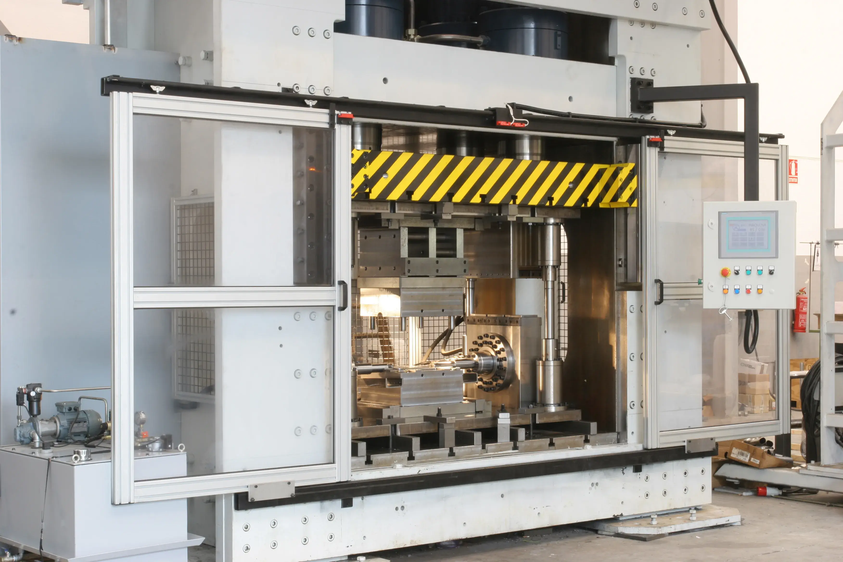 Stainless steel tube hydroforming press in a factory workshop